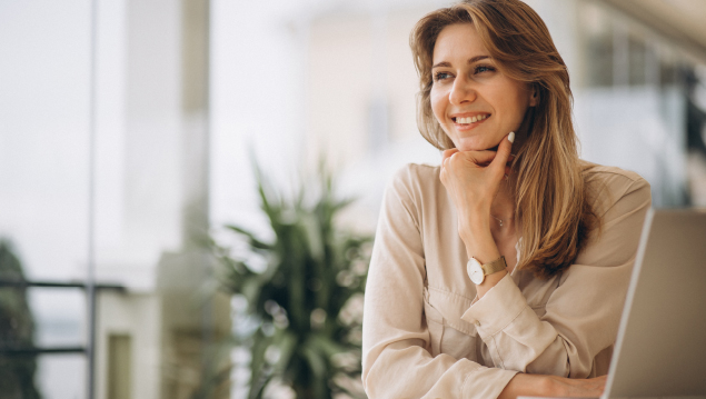 Portrait of a business woman working on laptop